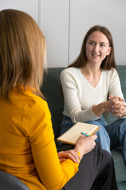 A person participates in a therapy session as part of an addiction treatment program.