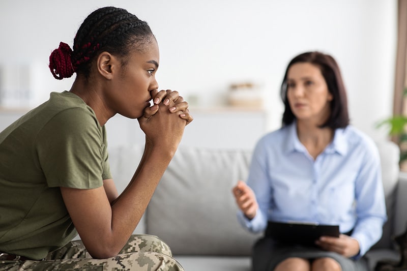 A military member participates in therapy at a drug rehab for active duty military.