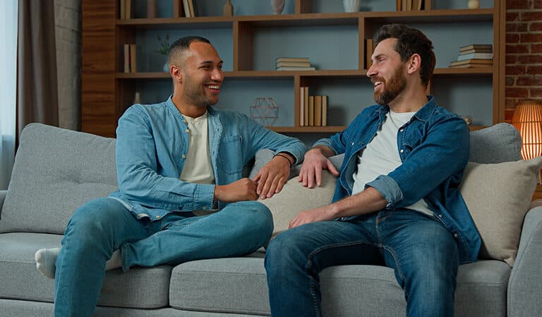 People talk at a sober living home.