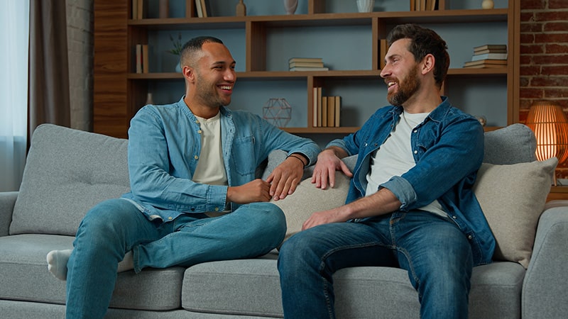 People talk at a sober living home.