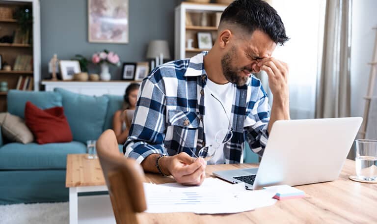 A man struggles with his mental health at work.