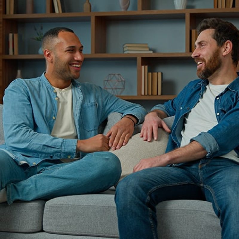 People talk at a sober living home.